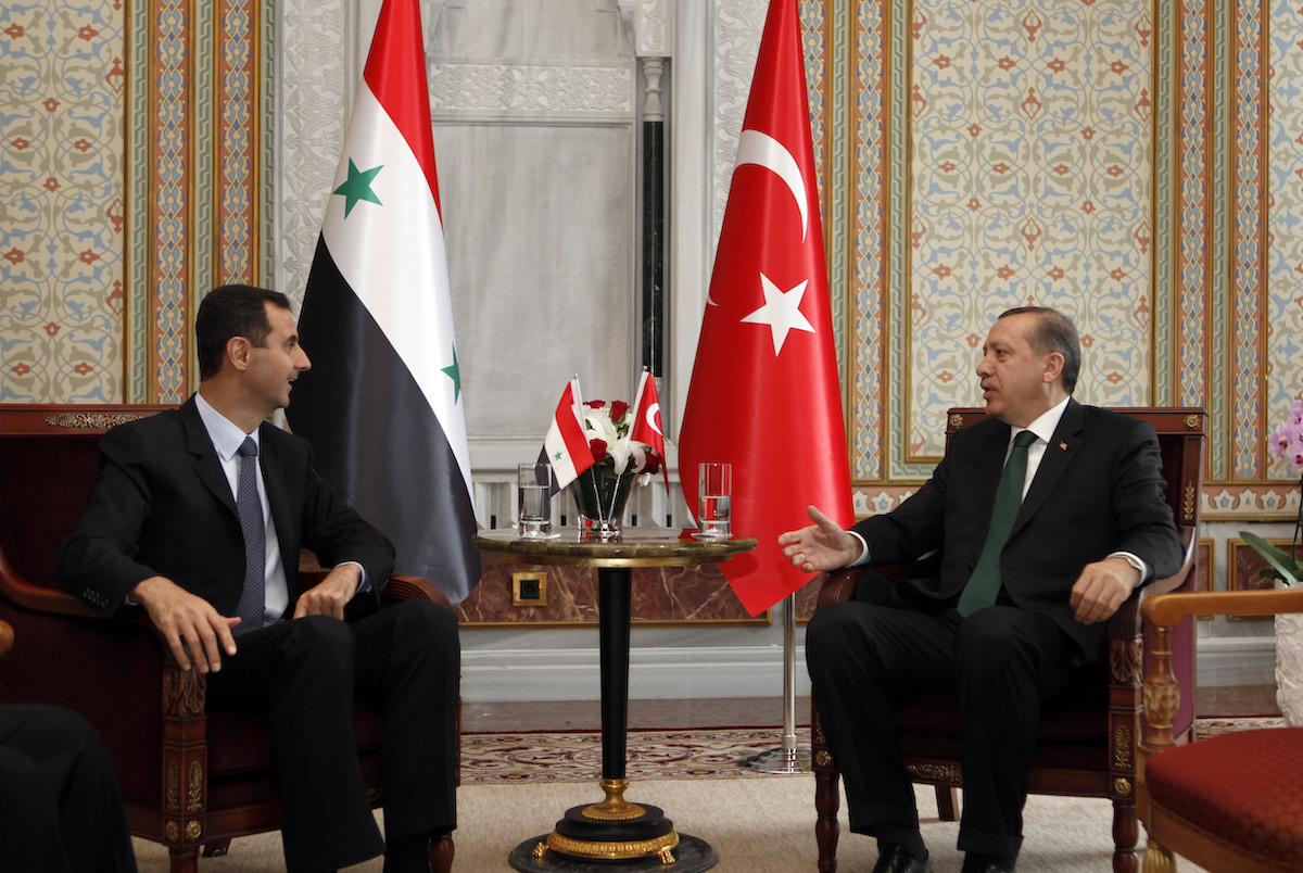 Turkey’s Prime Minister Erdogan talks with Syria’s President Bashar al-Assad during their meeting in Istanbul